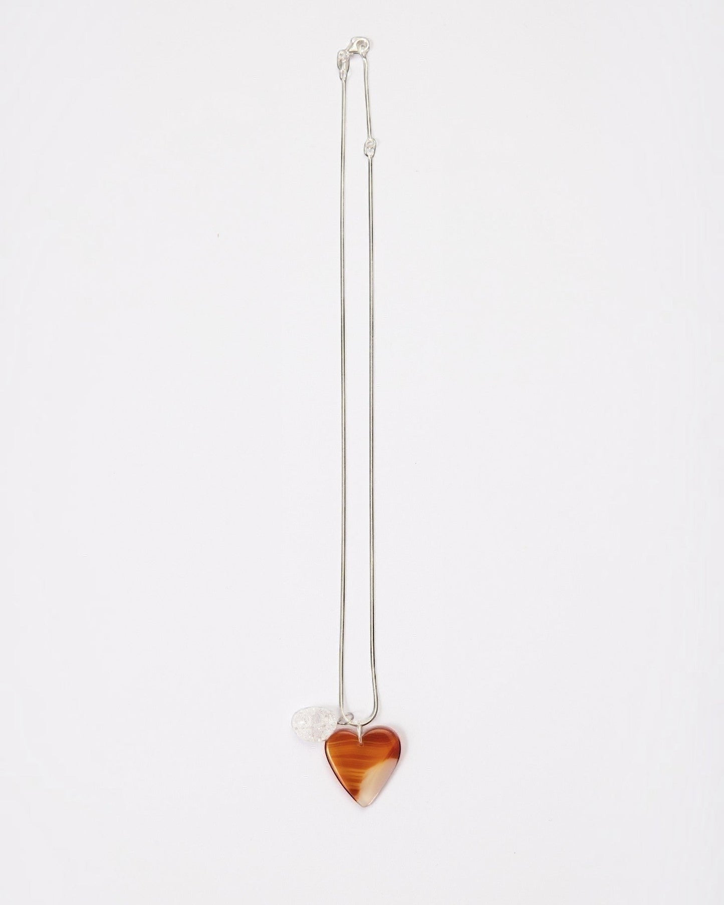 Elsita Jewelry Soda I heart-shaped red agate and clear quartz pendant necklace on a sterling silver snake chain