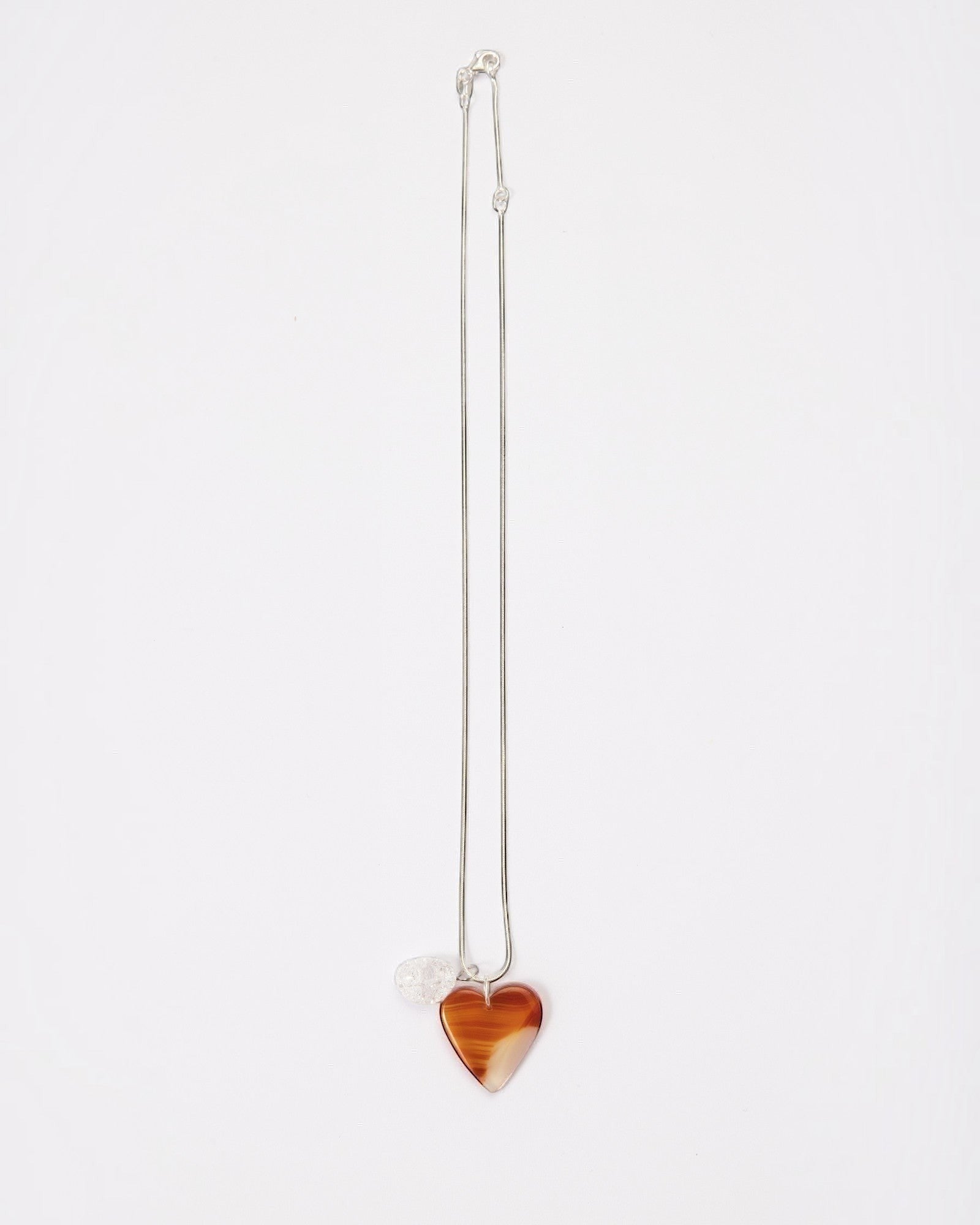 Elsita Jewelry Soda I heart-shaped red agate and clear quartz pendant necklace on a sterling silver snake chain