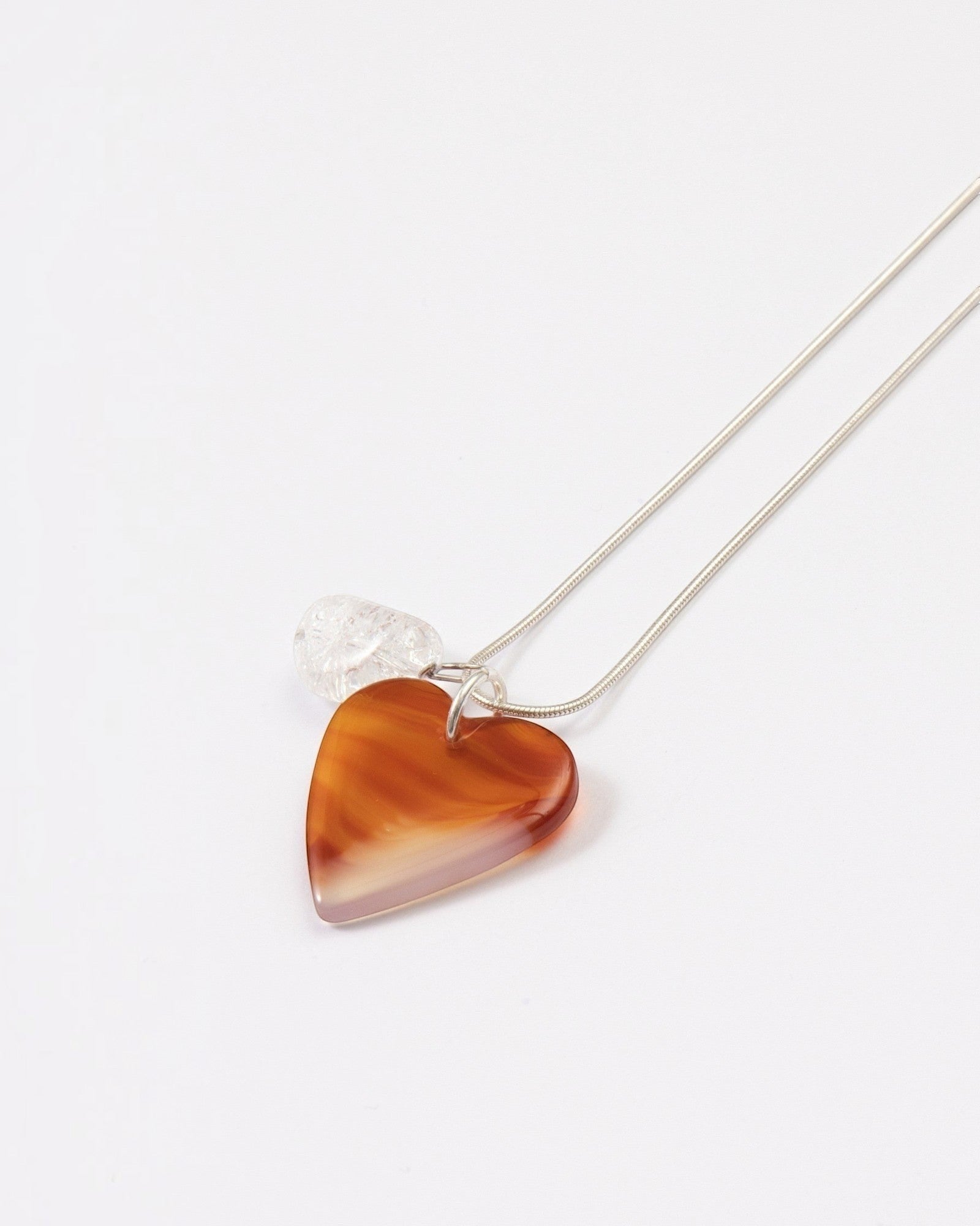Elsita Jewelry Soda I heart-shaped red agate and clear quartz pendant necklace on a sterling silver snake chain.