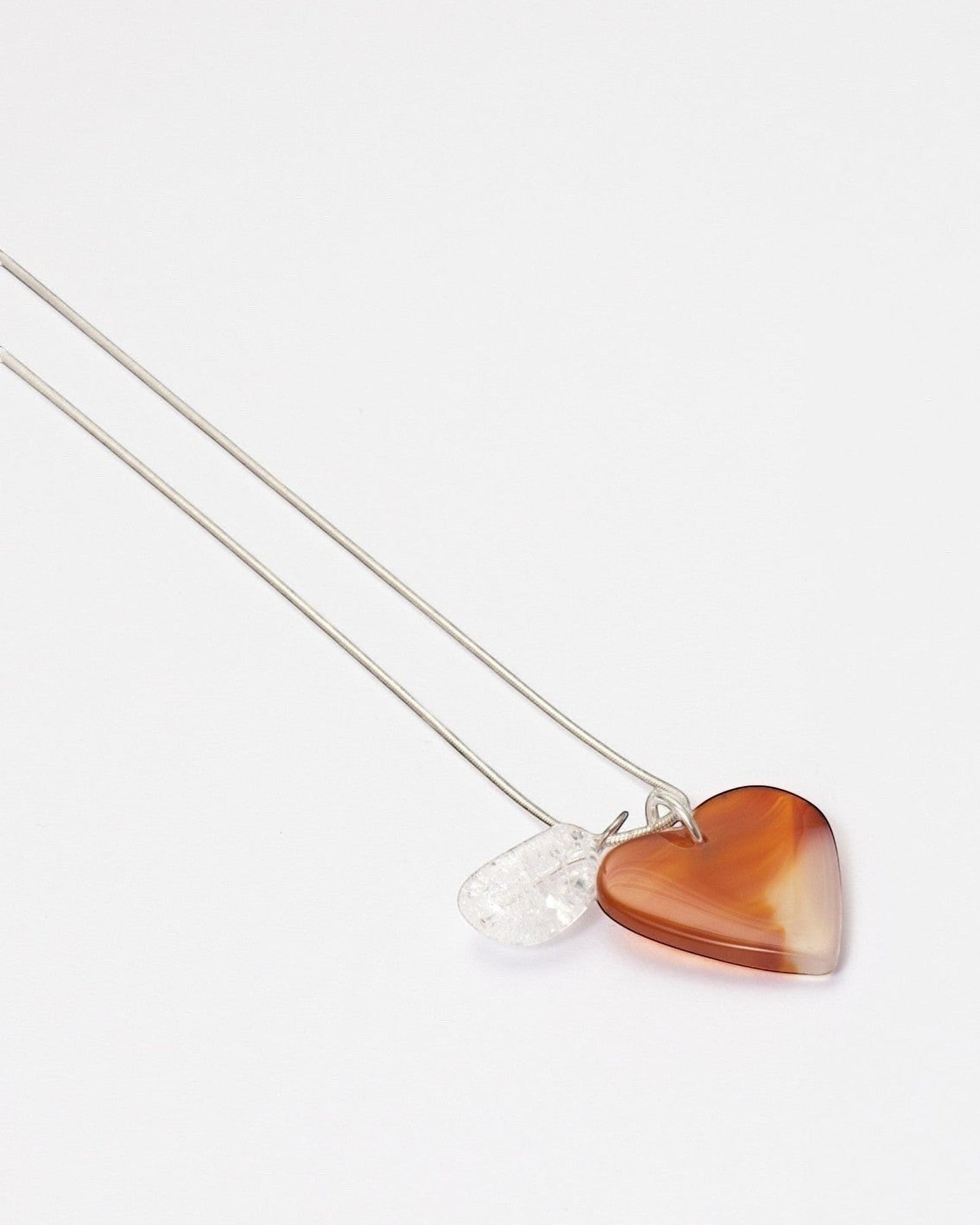 Elsita Jewelry Soda I heart-shaped red agate and clear quartz pendant necklace on a sterling silver snake chain.