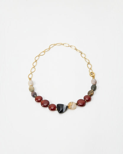 Elsita Jewelry Herbst necklace featuring earthy multi-colored gemstone beads and a gold chain link design.