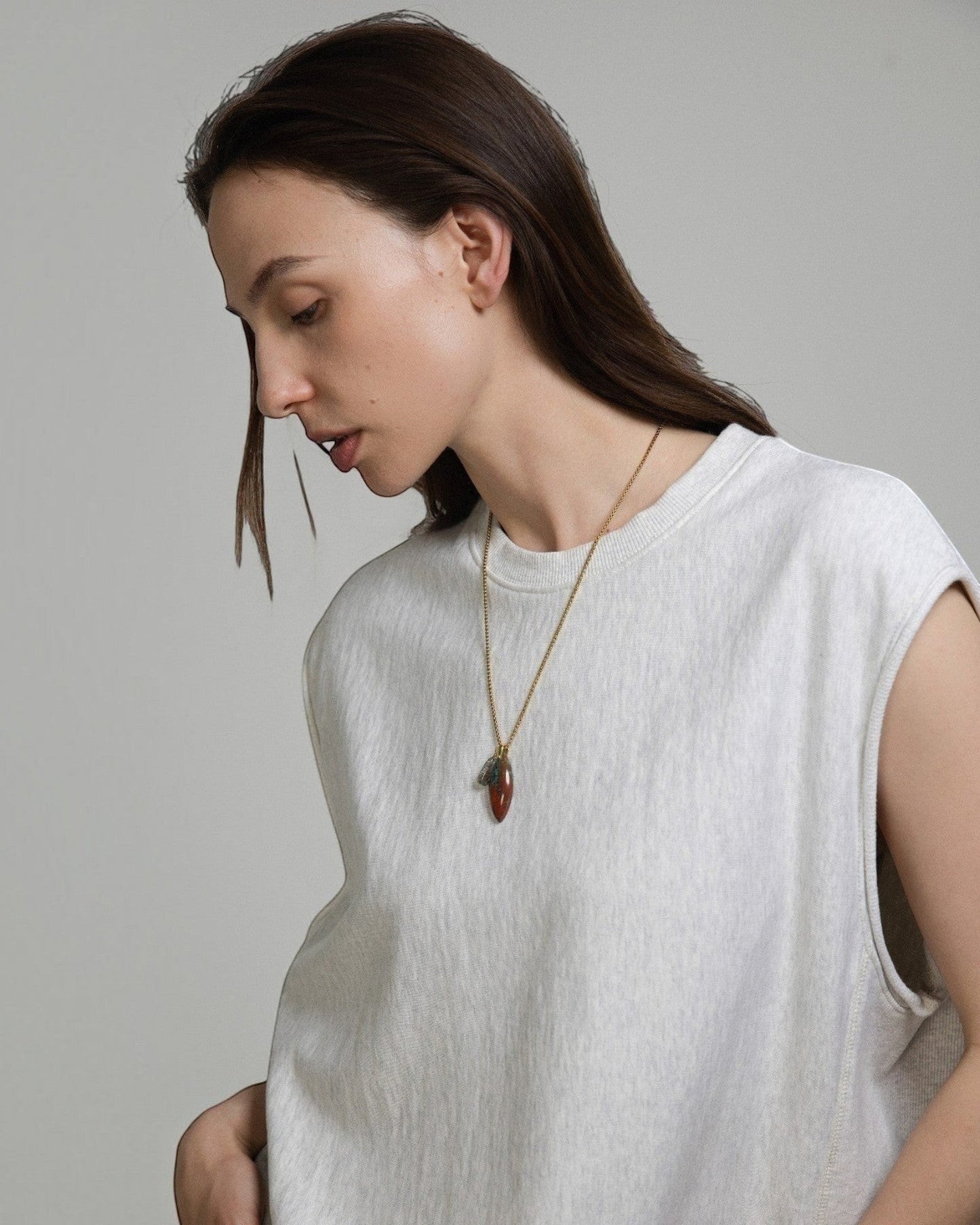 Elsita Jewelry Horizon I necklace featuring a Sonora sunset stone and green quartz pendant on a stainless steel chain.