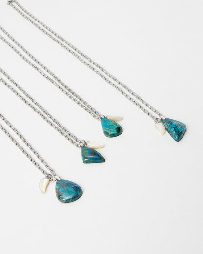 Elsita Jewelry Lagoon II necklaces featuring teardrop-shaped blue chrysocolla stones and small white shell accents