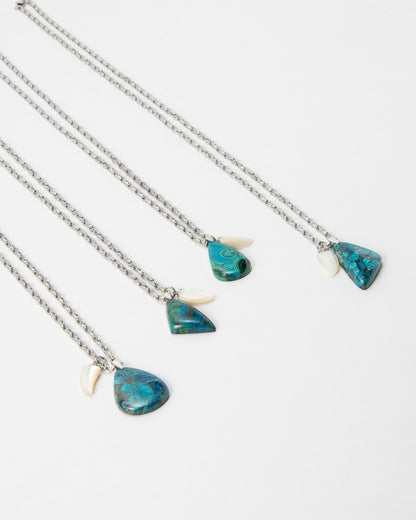 Elsita Jewelry Lagoon IV necklaces featuring teardrop-shaped blue and green chrysocolla stones and white shell accents.