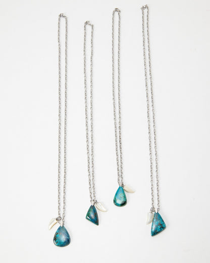Elsita Jewelry Lagoon IV silver chain necklaces with teardrop blue stone pendants and small white shell accents