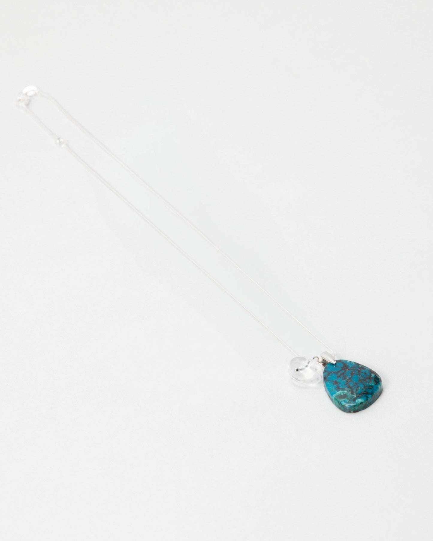 Elsita Jewelry Marine necklace featuring a teardrop-shaped blue turquoise stone pendant on a delicate silver chain.