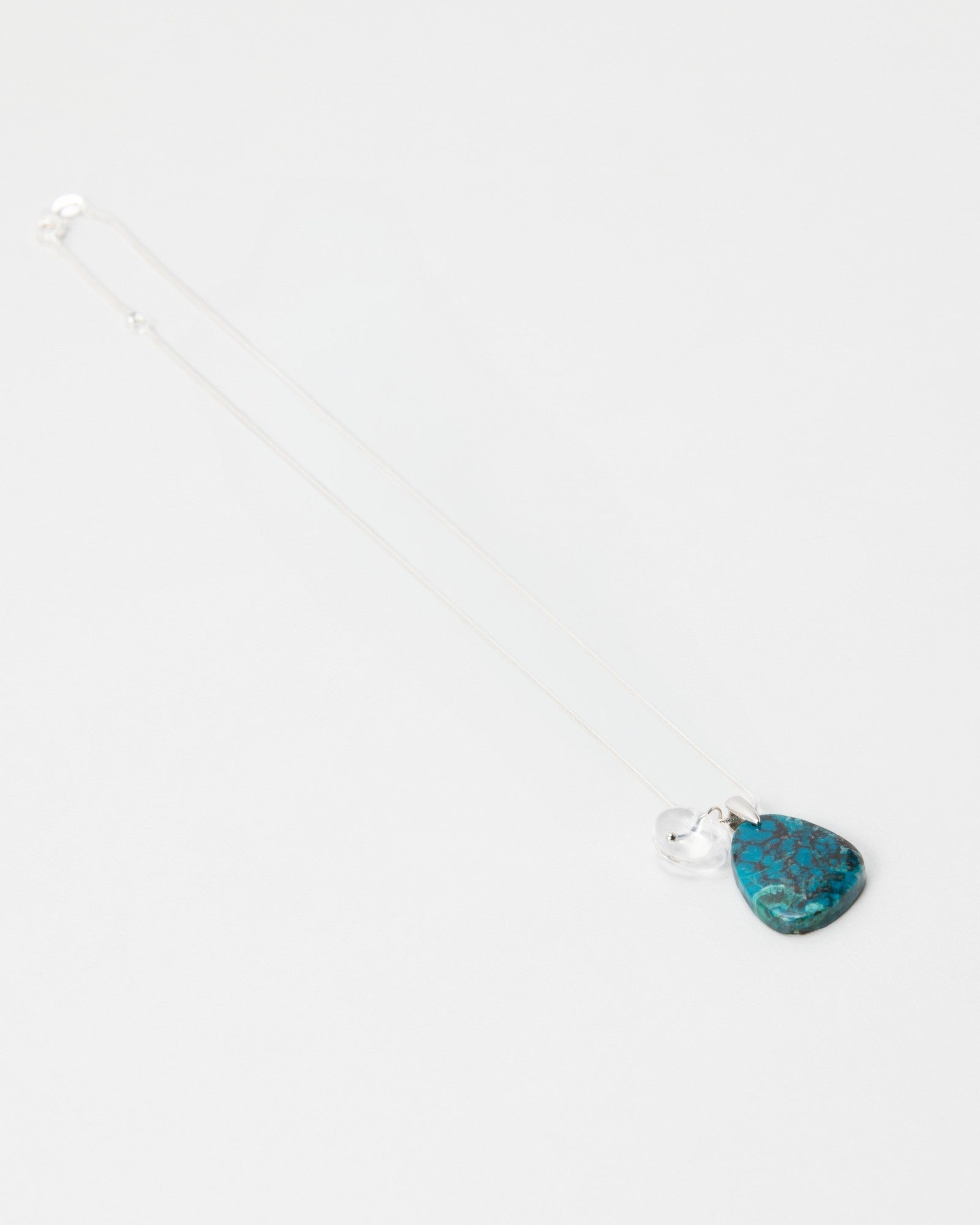 Elsita Jewelry Marine necklace featuring a teardrop-shaped blue turquoise stone pendant on a delicate silver chain.