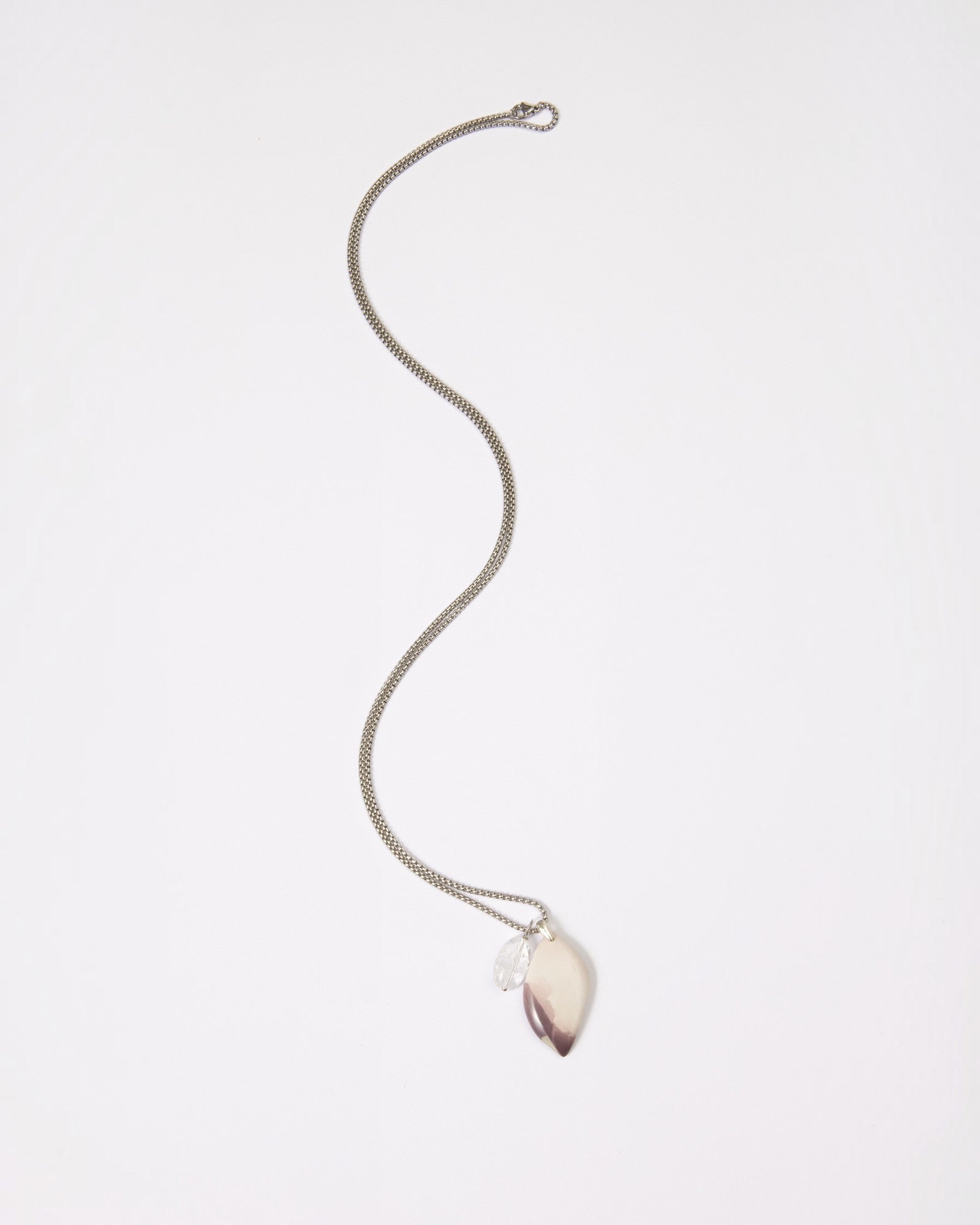 Elsita Jewelry Mauve IV necklace featuring a Hyacinth Jasper pendant and clear quartz on a sterling silver chain.