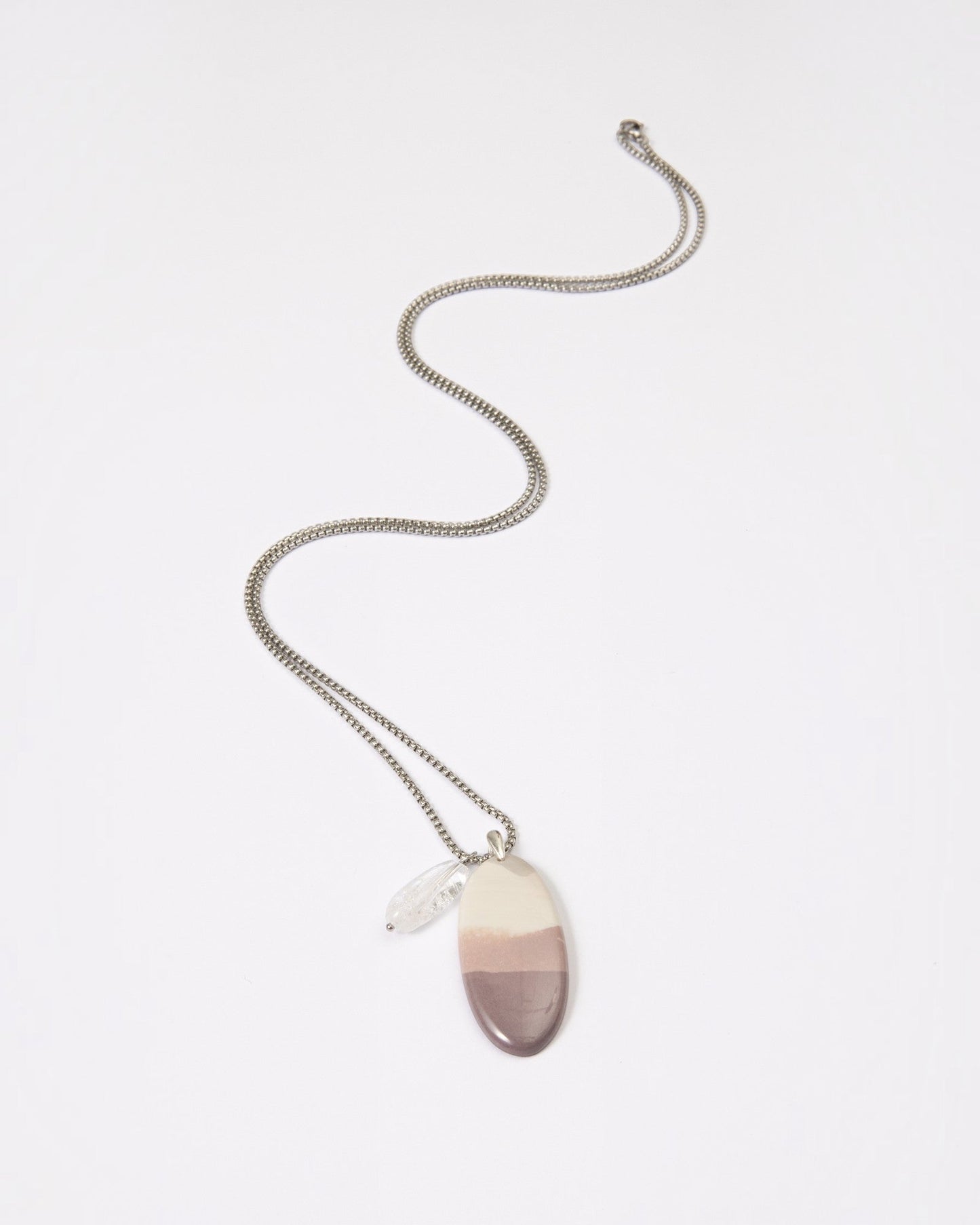 Elsita Jewelry Mauve I necklace featuring a smooth Hyacinth Jasper pendant with lavender tones and a clear quartz charm.