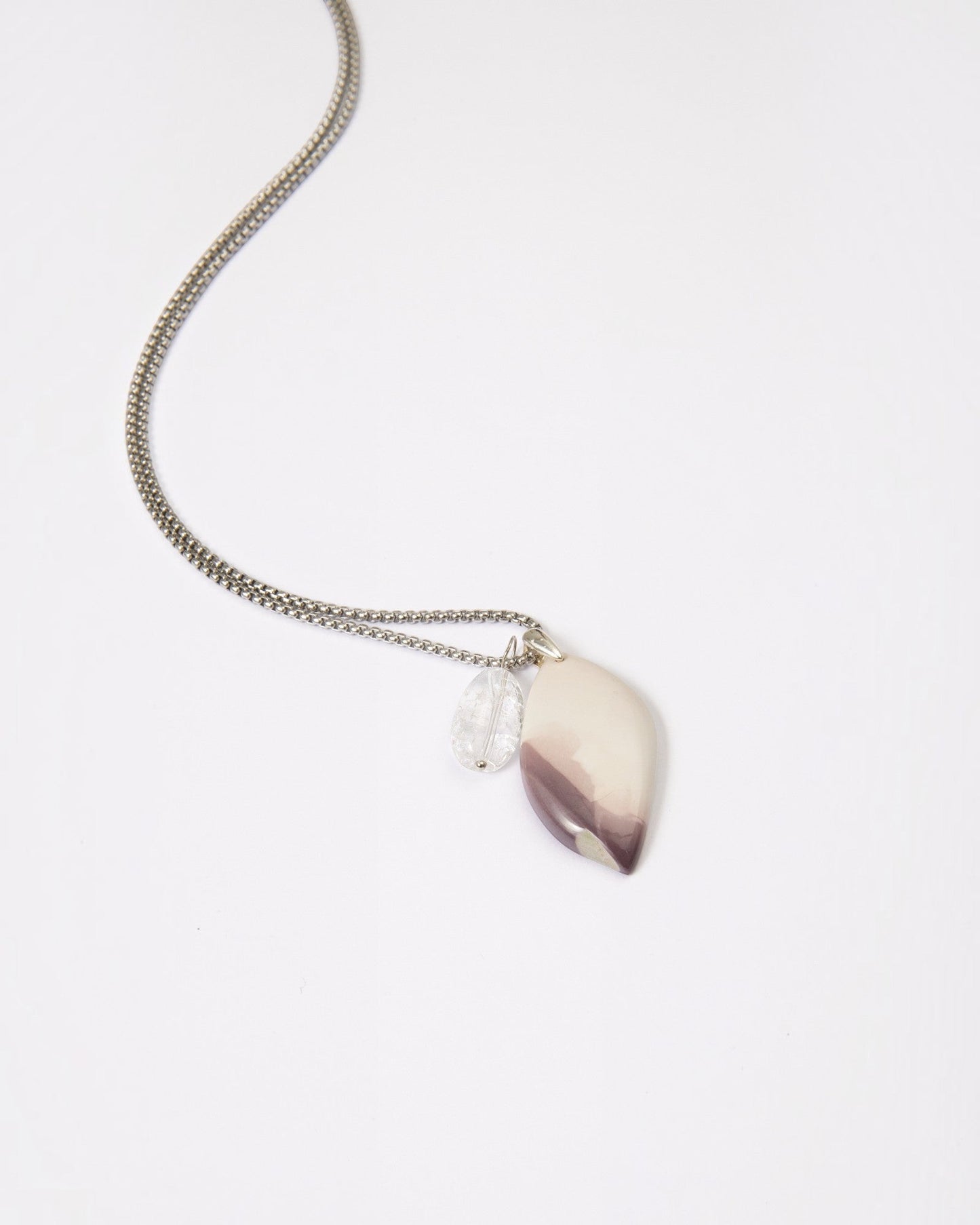 Elsita Jewelry Mauve IV pendant necklace featuring a unique Hyacinth Jasper stone and clear quartz on a silver chain.
