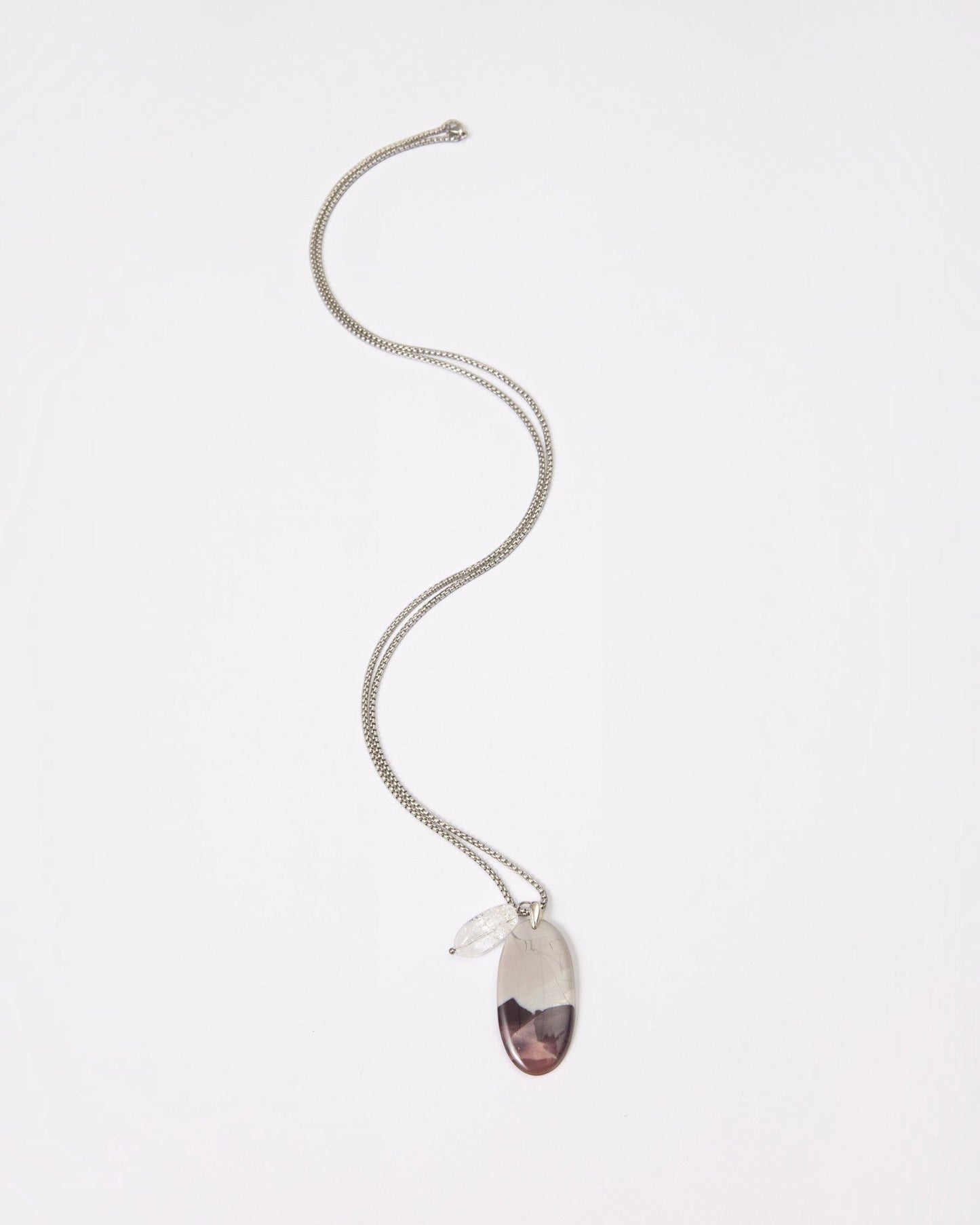 Elsita Jewelry Mauve III pendant necklace featuring a Hyacinth Jasper stone and clear quartz on a silver chain.