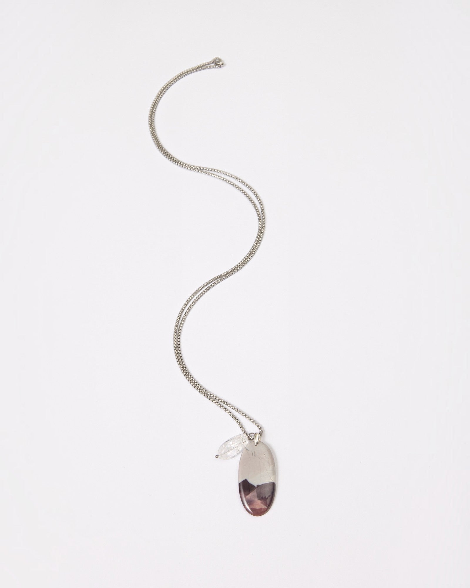 Elsita Jewelry Mauve III pendant necklace featuring a Hyacinth Jasper stone and clear quartz on a silver chain.