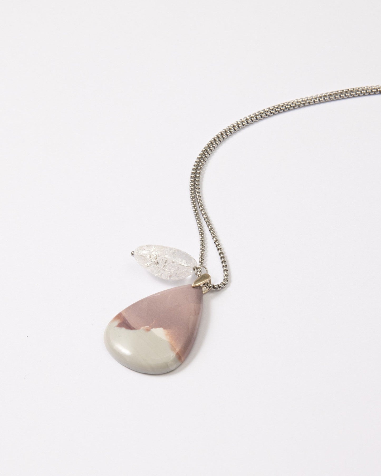 Elsita Jewelry Mauve V necklace featuring a teardrop Hyacinth Jasper pendant and clear quartz on a stainless steel chain.