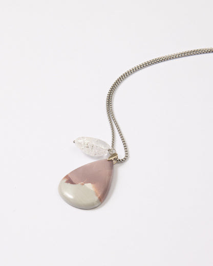 Elsita Jewelry Mauve V necklace featuring a teardrop Hyacinth Jasper pendant and clear quartz on a stainless steel chain.