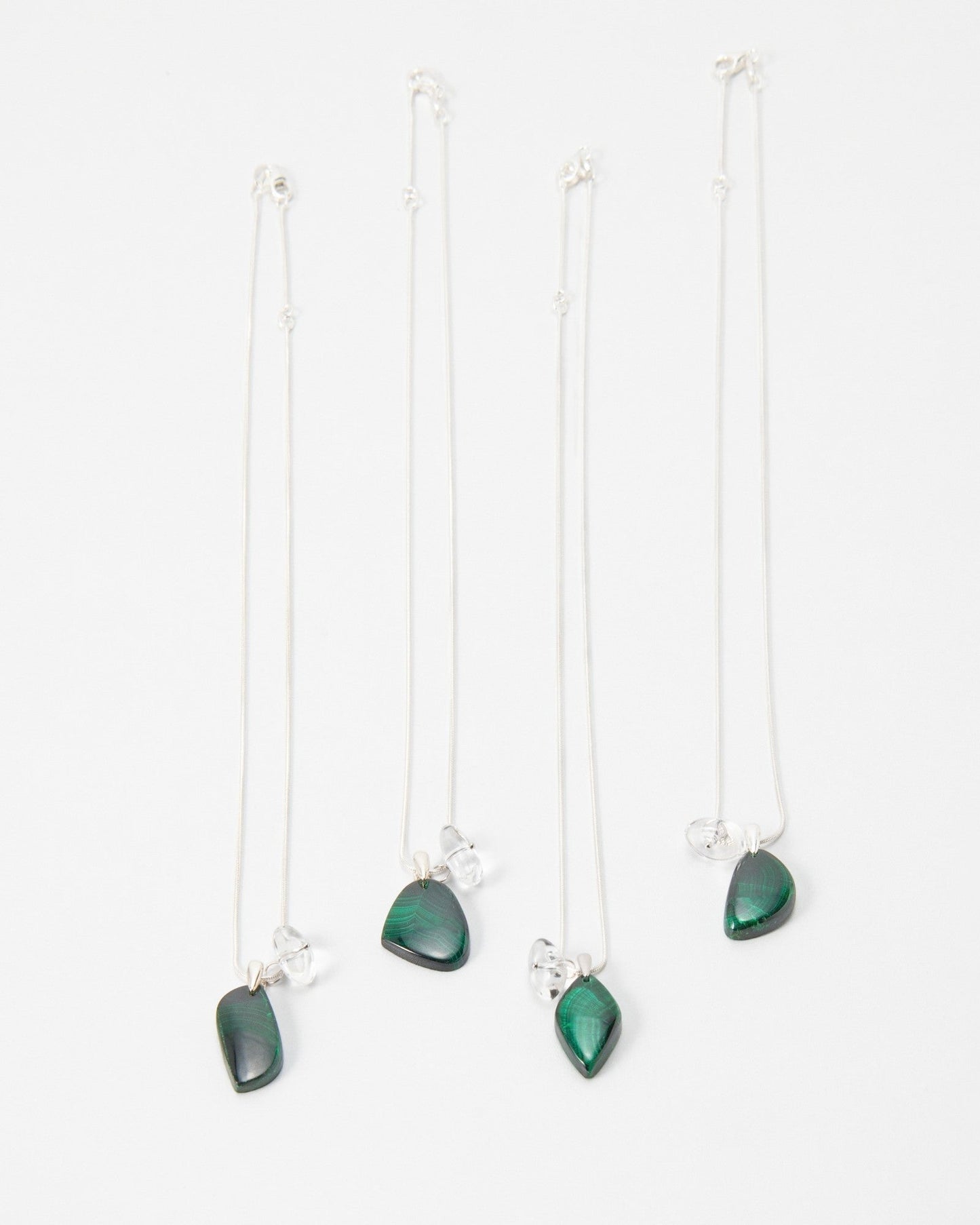 Elsita Jewelry Midnight necklaces featuring dark green stone pendants on delicate silver chains