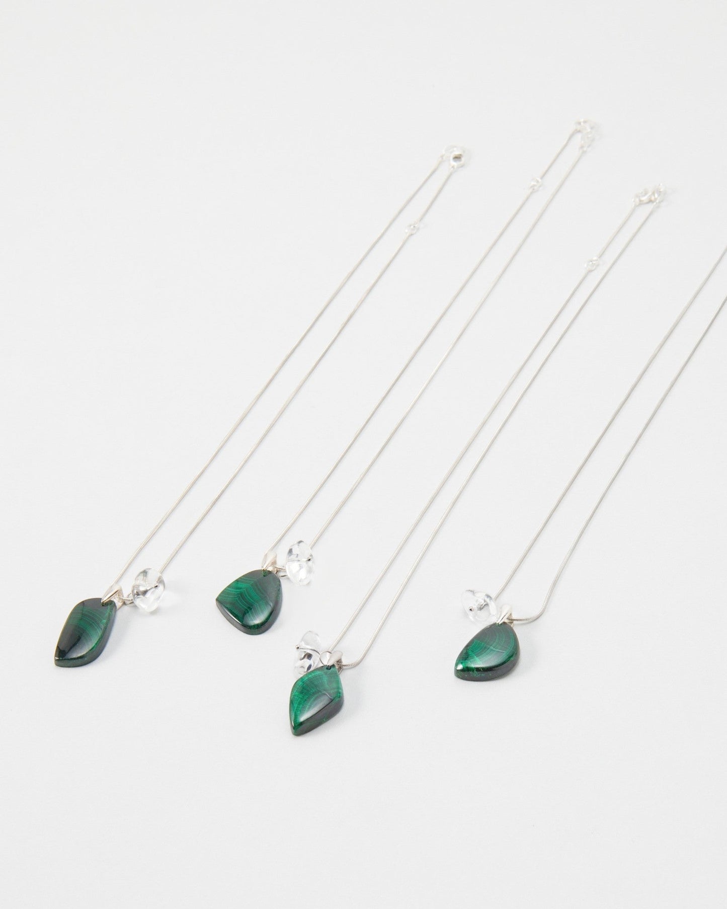 Elsita Jewelry Midnight necklaces featuring dark green teardrop stones on delicate silver chains