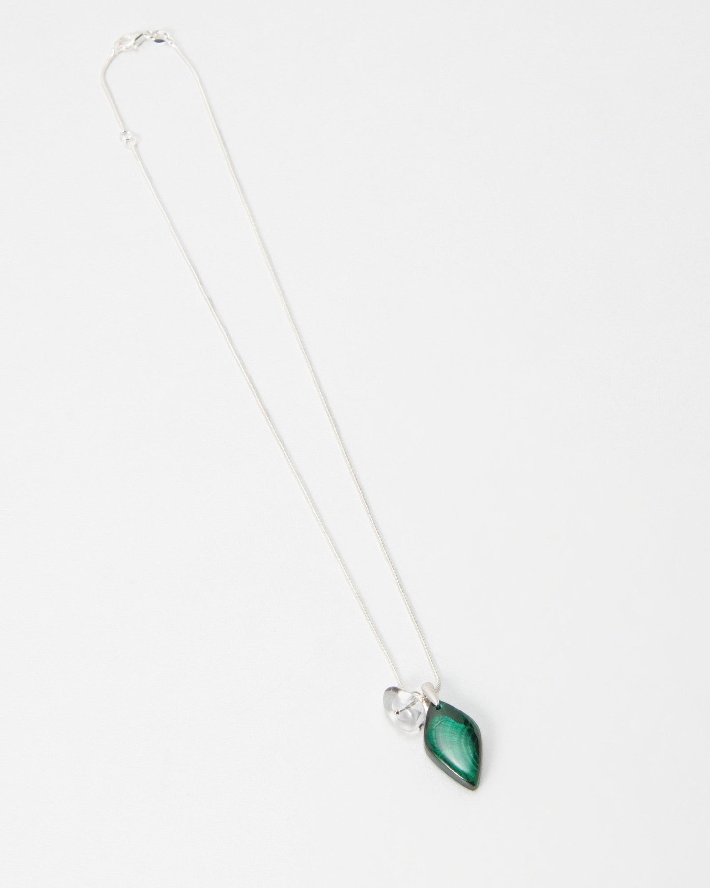Elsita Jewelry Midnight necklace featuring a green malachite stone pendant on a delicate silver chain