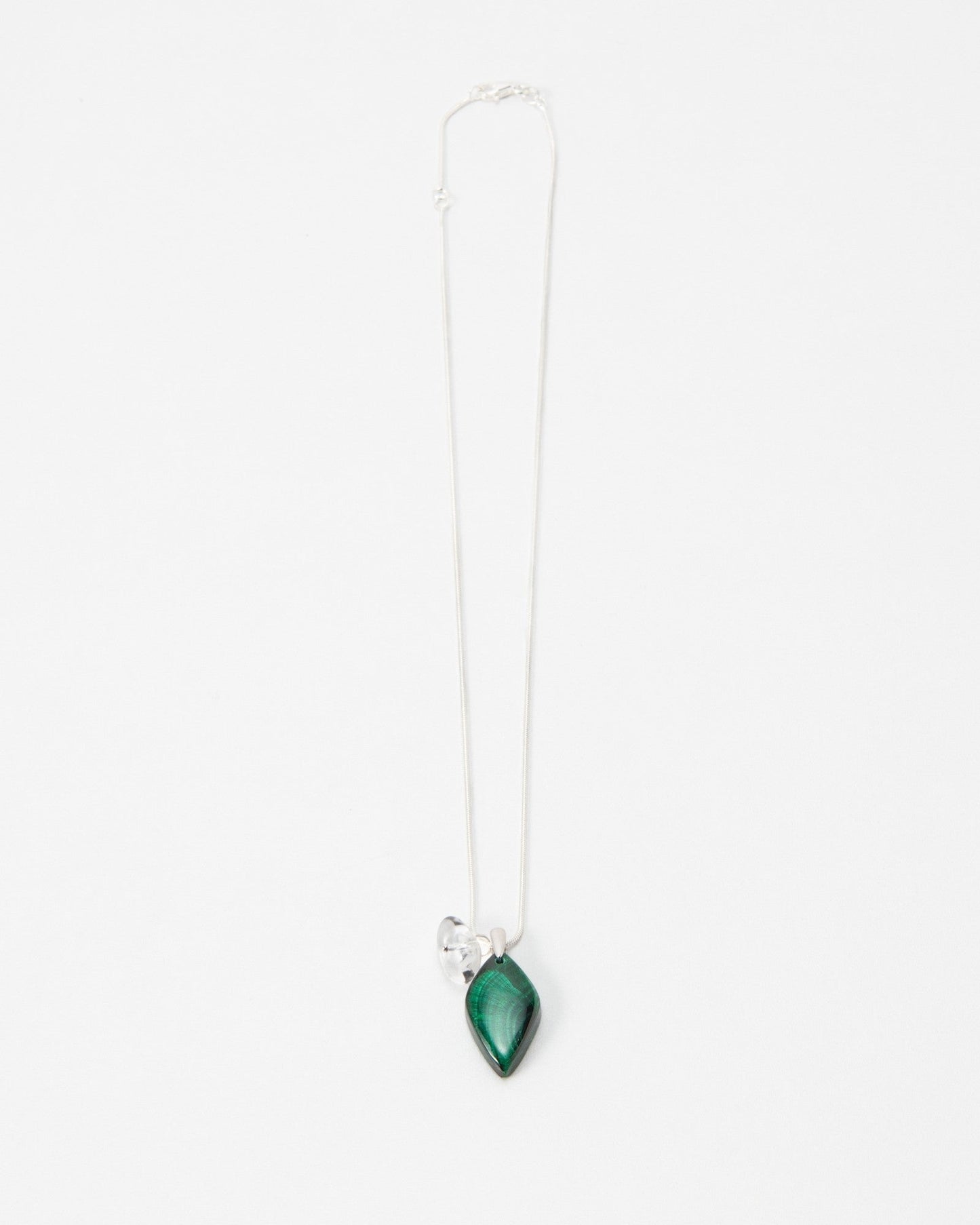 Elsita Jewelry Midnight necklace featuring a teardrop-shaped green malachite stone on a delicate silver chain.