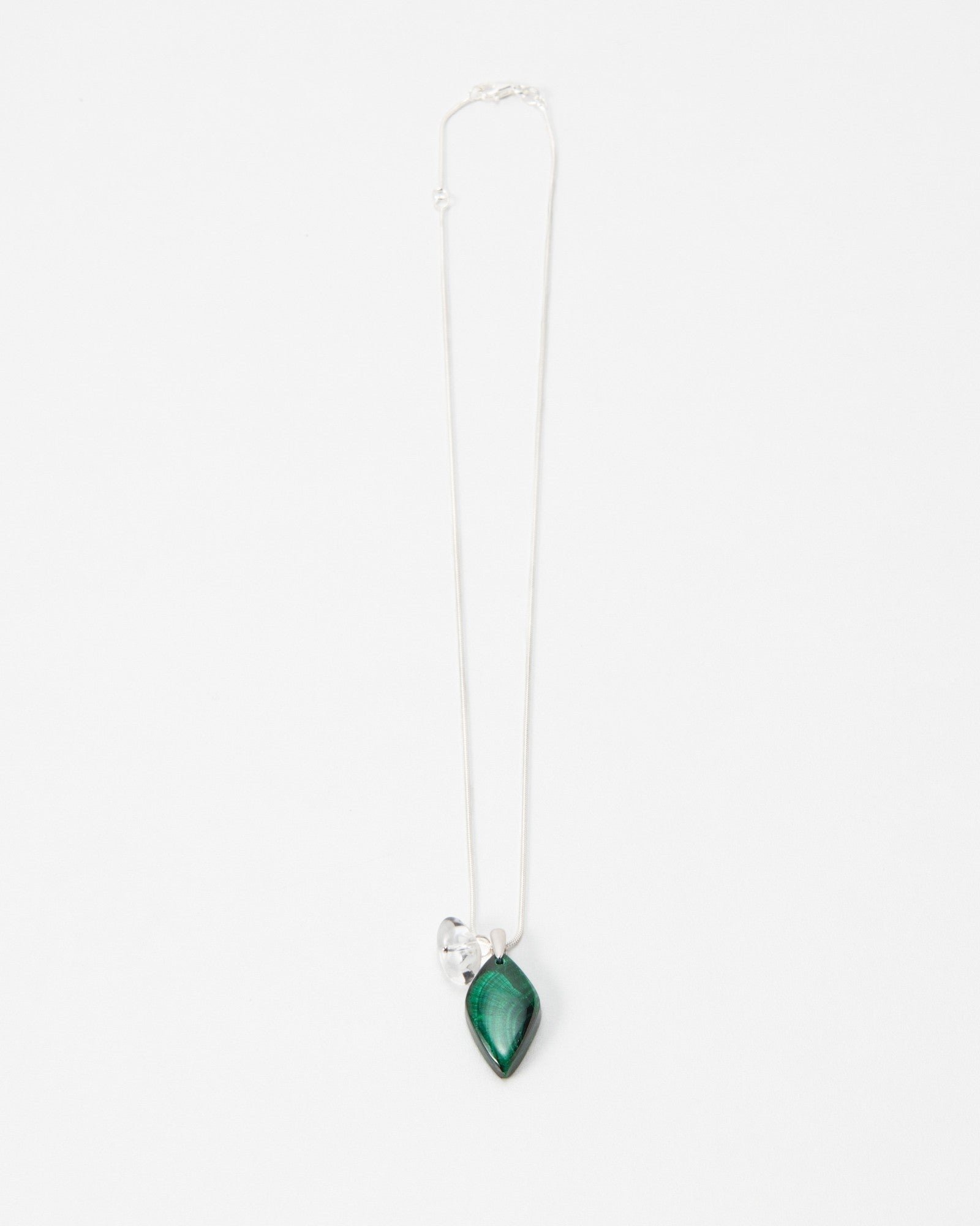 Elsita Jewelry Midnight necklace featuring a teardrop-shaped green malachite stone on a delicate silver chain.