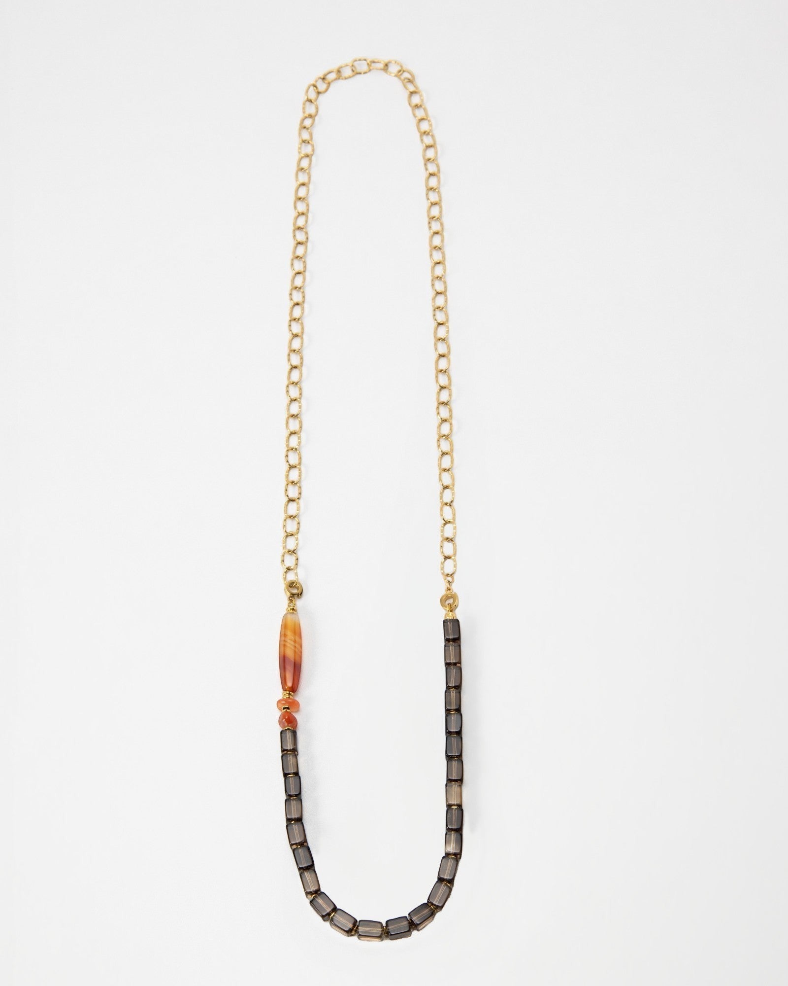 Elsita Jewelry Mosaic long necklace featuring a gold chain, smoky quartz cubes, and faceted red agate and hematite beads.