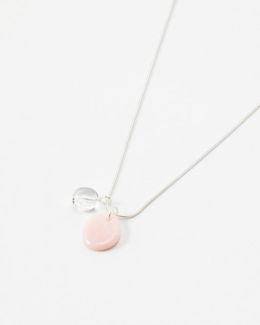 Elsita Jewelry Petal Clear necklace featuring a delicate silver chain with a pink petal charm and clear bead accent.