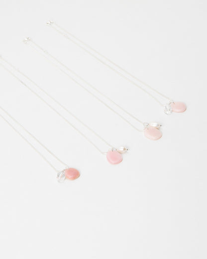Elsita Jewelry Petal Clear necklaces featuring delicate pink petal charms and clear accents on silver chains