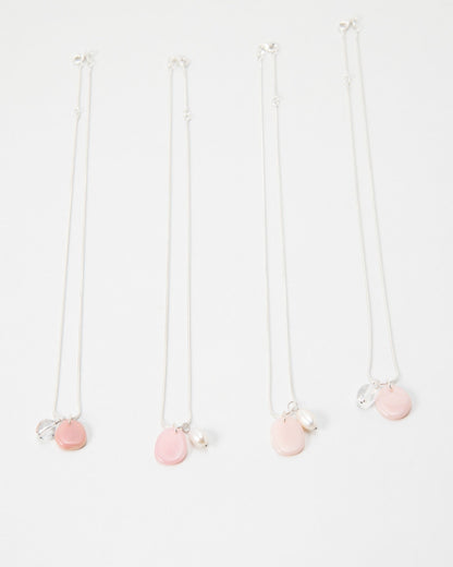Elsita Jewelry Petal Clear necklaces featuring delicate silver chains with pink petal charms and pearl accents.