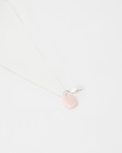 Elsita Jewelry Petal Pearl necklace featuring a delicate silver chain with a pink stone and white pearl pendant