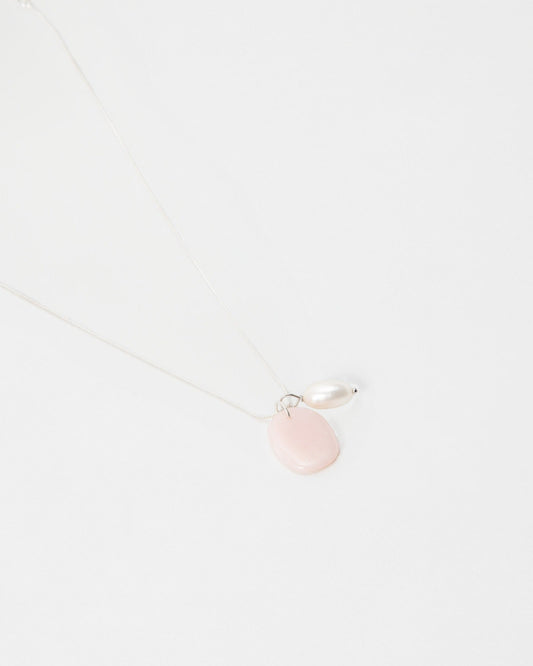 Elsita Jewelry Petal Pearl necklace featuring a delicate silver chain with a pink stone and white pearl pendant