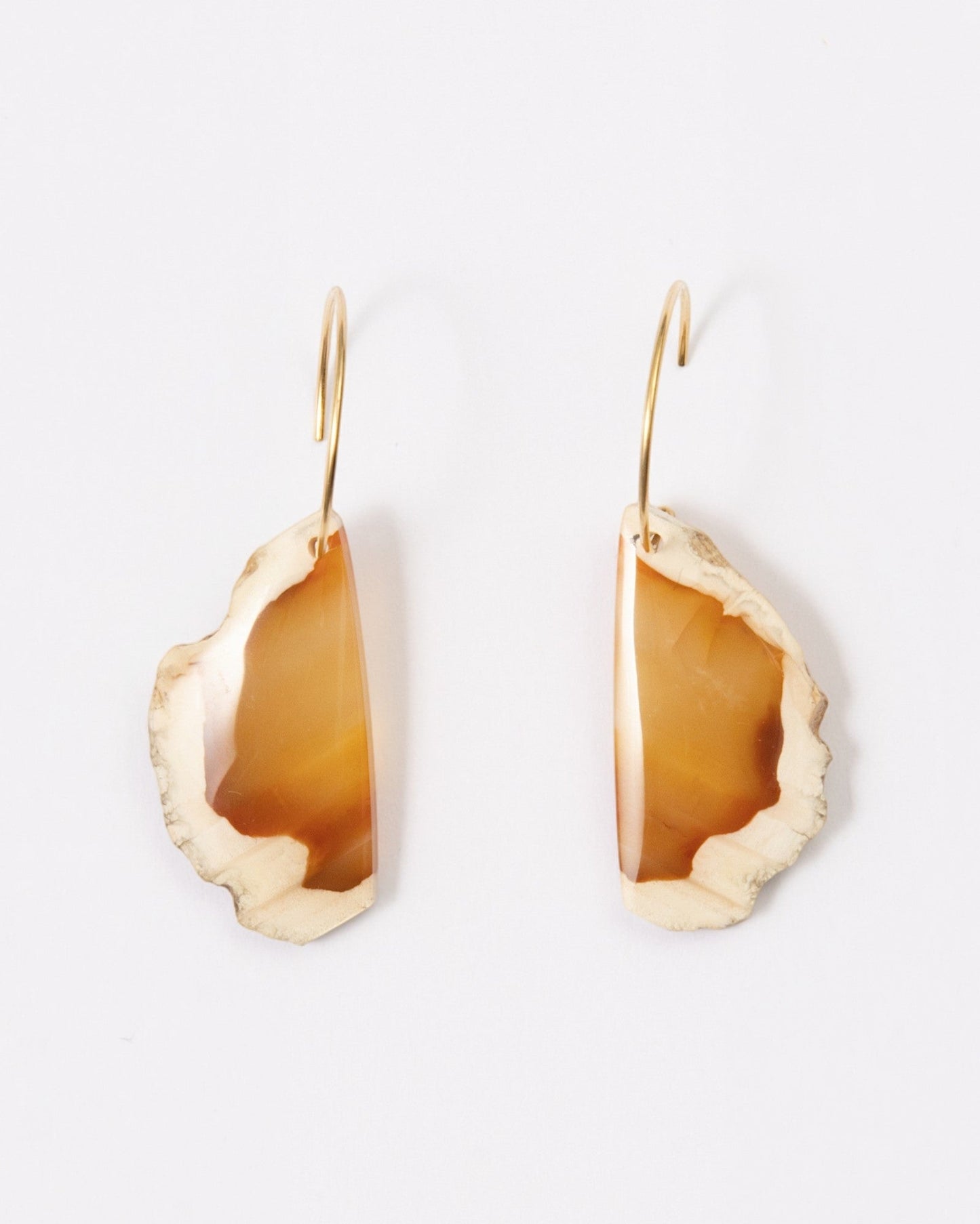 Elsita Jewelry Wild 16 earrings featuring raw, freeform Indonesian agate slices on 14K gold-filled hoops.
