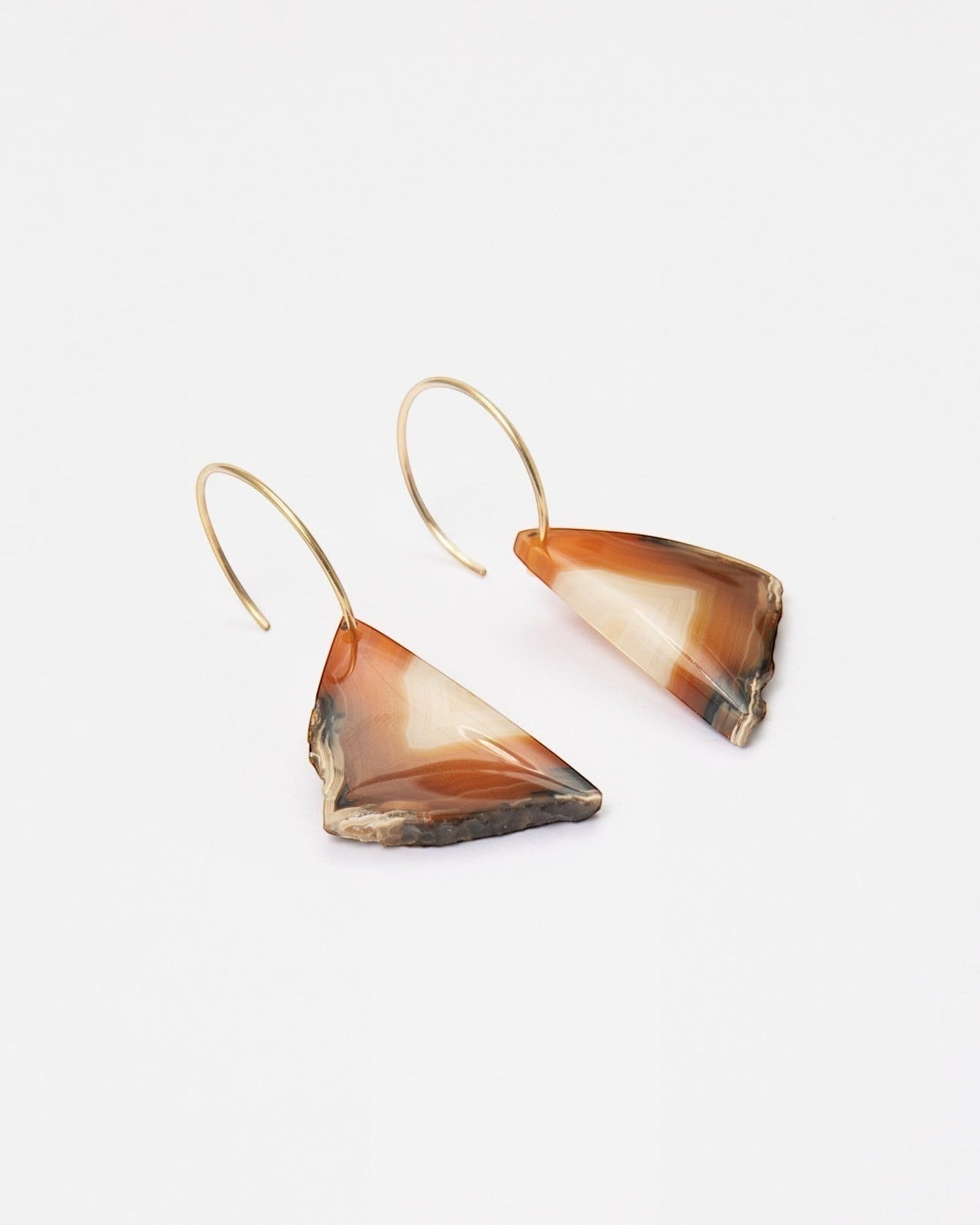 Elsita Jewelry Wild 13 raw Indonesian agate slice earrings on 14K gold-filled hoops with earthy banded patterns.