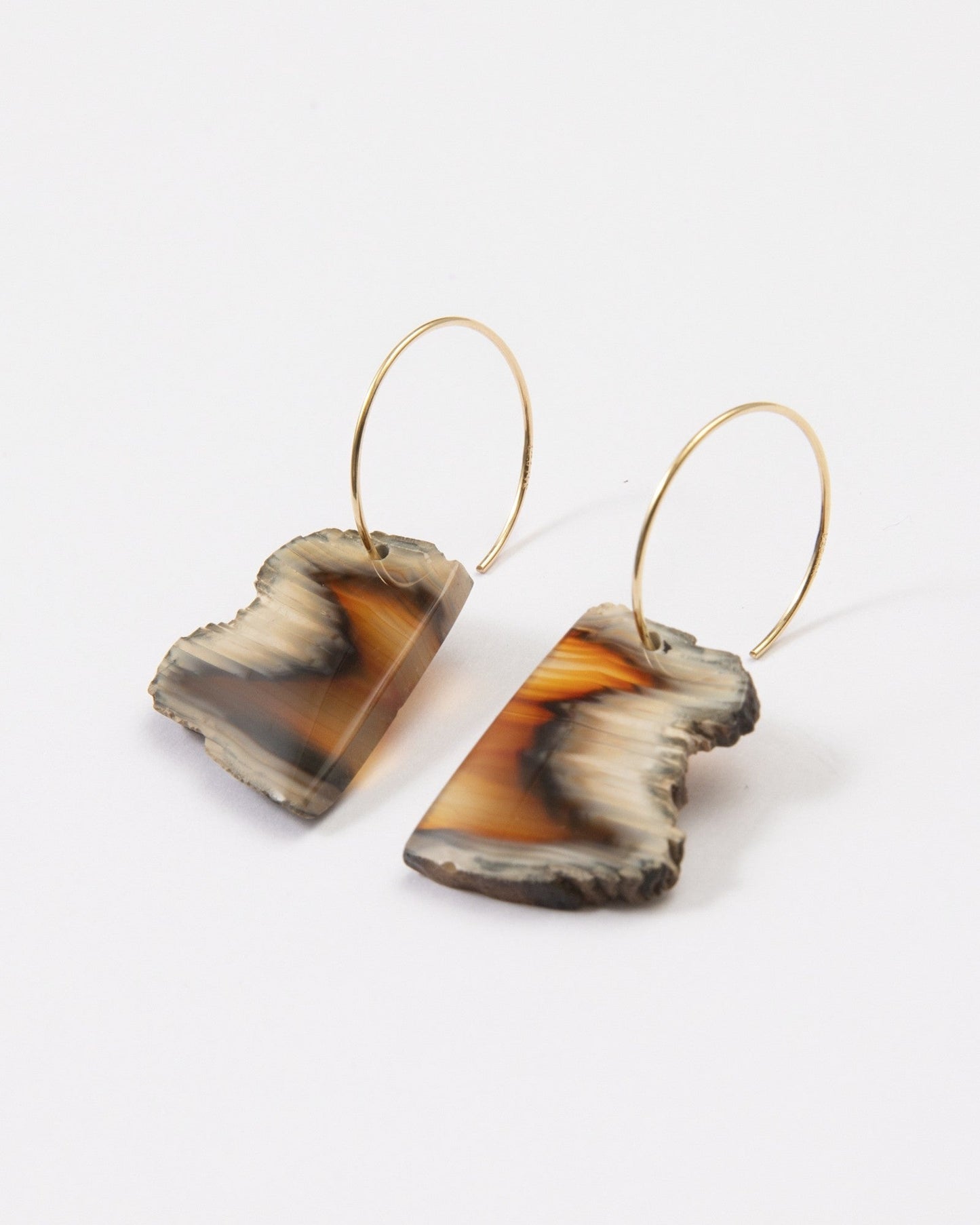 Elsita Jewelry Wild 9 earrings featuring freeform Indonesian agate slices with raw edges on 14K gold-filled hoops.
