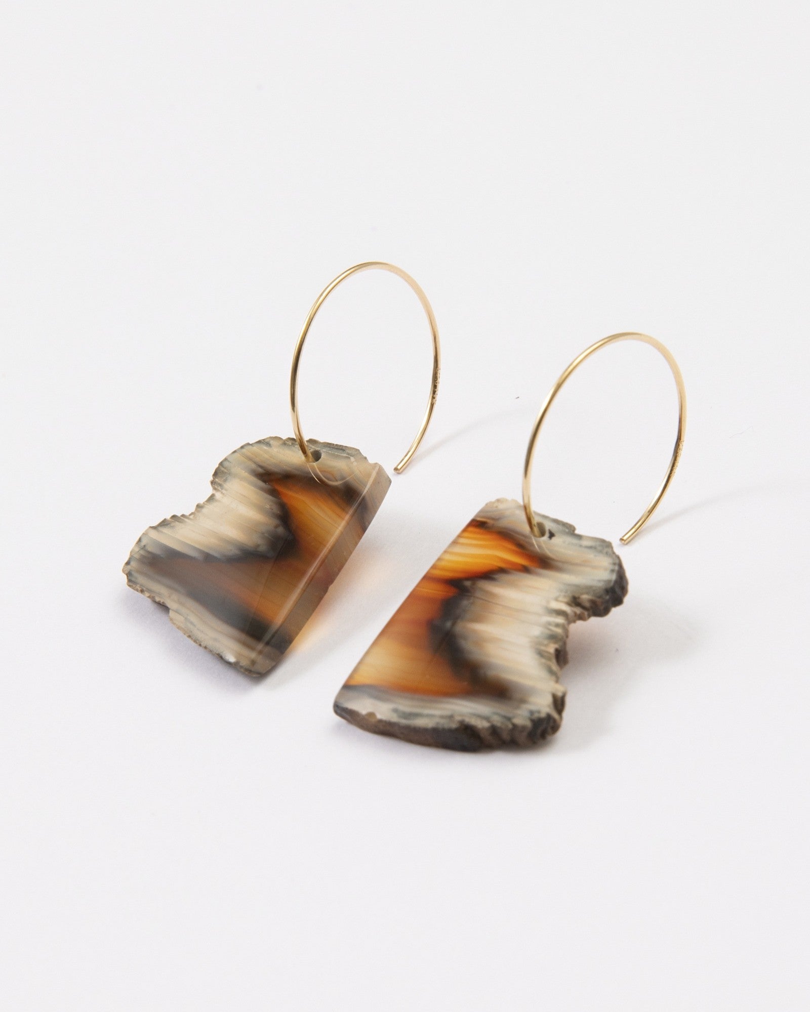 Elsita Jewelry Wild 9 earrings featuring freeform Indonesian agate slices with raw edges on 14K gold-filled hoops.