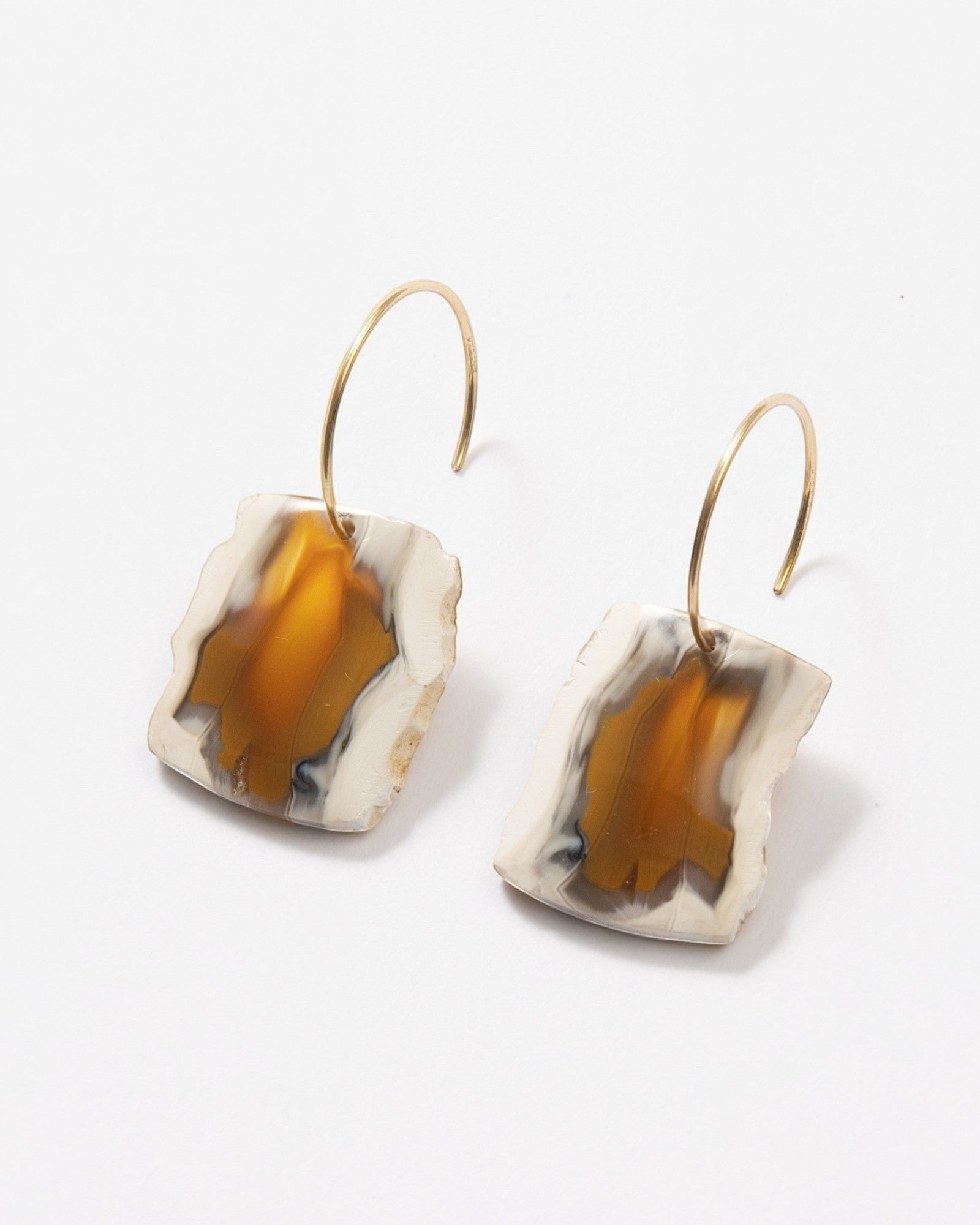 Elsita Jewelry Wild 20 raw Indonesian agate slice earrings on 14K gold-filled hoops with earthy beige and brown banding.