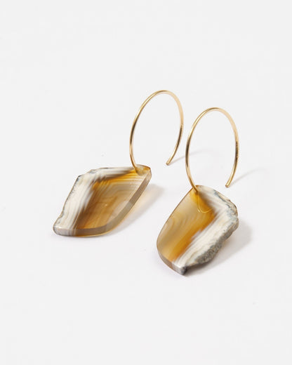 Elsita Jewelry Wild 19 earrings featuring raw, freeform Indonesian agate slices on 14K gold-filled hoops.
