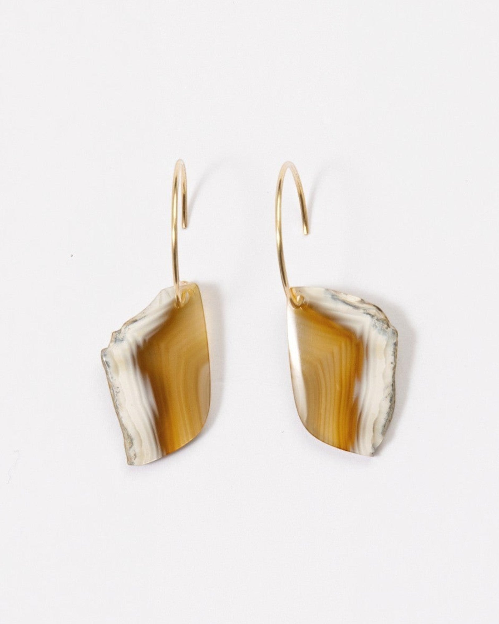 Elsita Jewelry Wild 19 earrings featuring raw Indonesian agate slices in beige and brown on 14K gold-filled hoops.