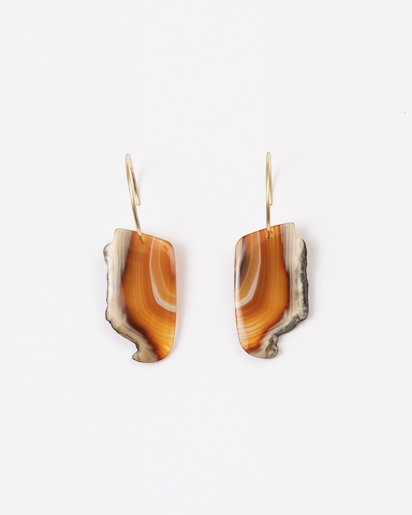 Elsita Jewelry Wild 8 earrings featuring raw Indonesian agate slices in warm orange and brown on 14K gold-filled hoops.