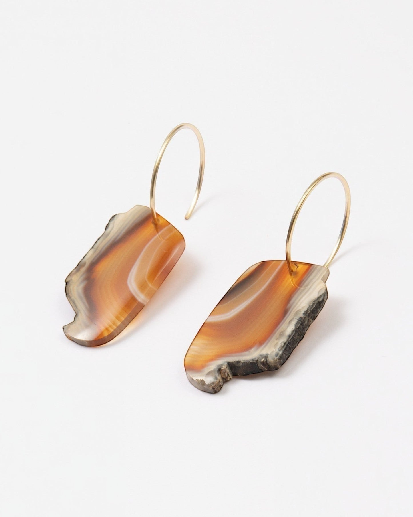 Elsita Jewelry Wild 8 earrings featuring raw, freeform Indonesian agate slices on 14K gold-filled hoops.