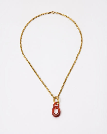 Elsita Jewelry Link Red necklace featuring hand-carved red agate interlocked chain pendant on a gold-tone metal chain.