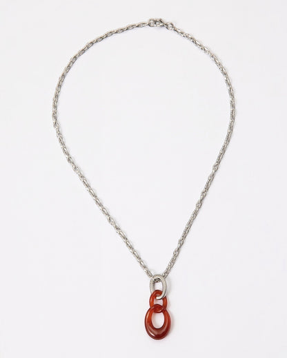 Elsita Jewelry Link Red necklace featuring a hand-carved red agate interlocked chain pendant on a silver-tone chain.