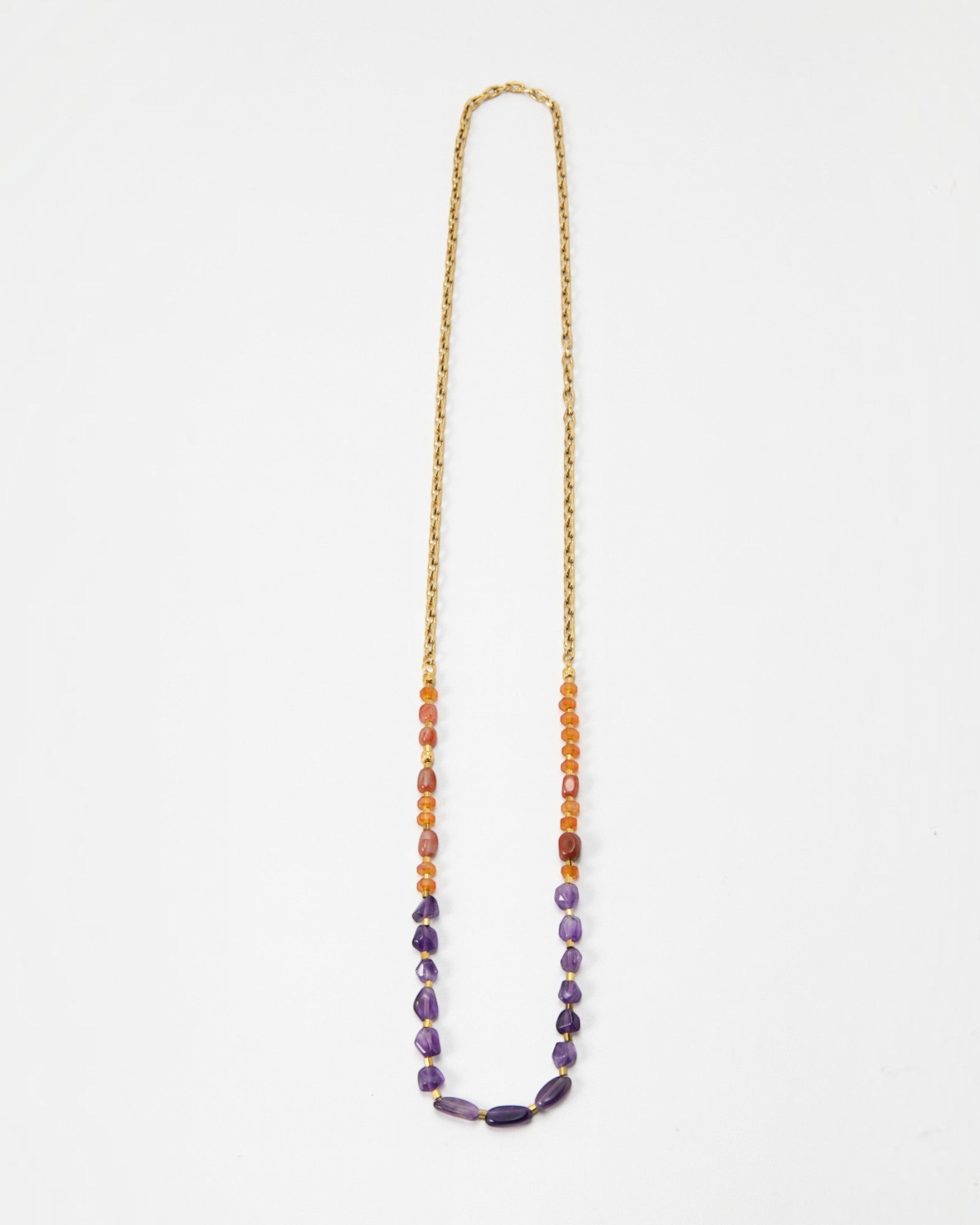 Elsita Jewelry Rhythm long necklace featuring red agate, carnelian, and amethyst beads on a gold stainless steel chain.