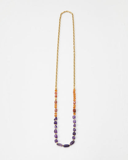 Elsita Jewelry Rhythm long necklace featuring red agate, carnelian, and amethyst beads on a gold stainless steel chain.