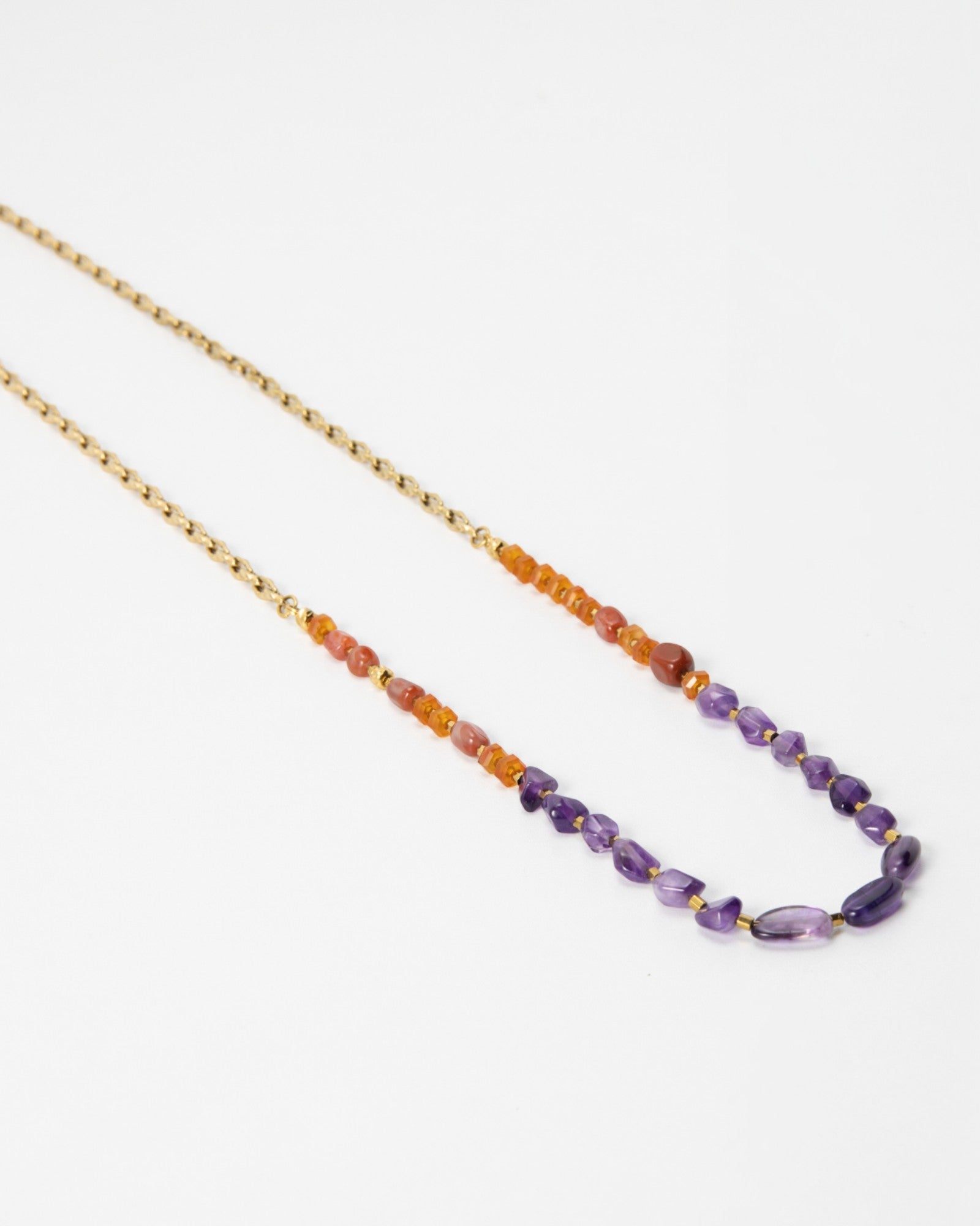 Elsita Jewelry Rhythm necklace featuring red agate, carnelian, and amethyst beads on a gold stainless-steel chain.