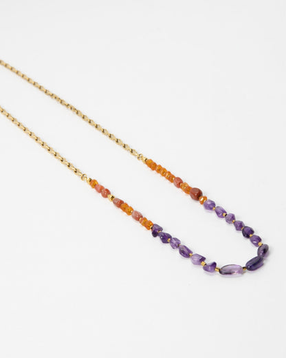 Elsita Jewelry Rhythm necklace featuring red agate, carnelian, and amethyst beads on a gold stainless-steel chain.