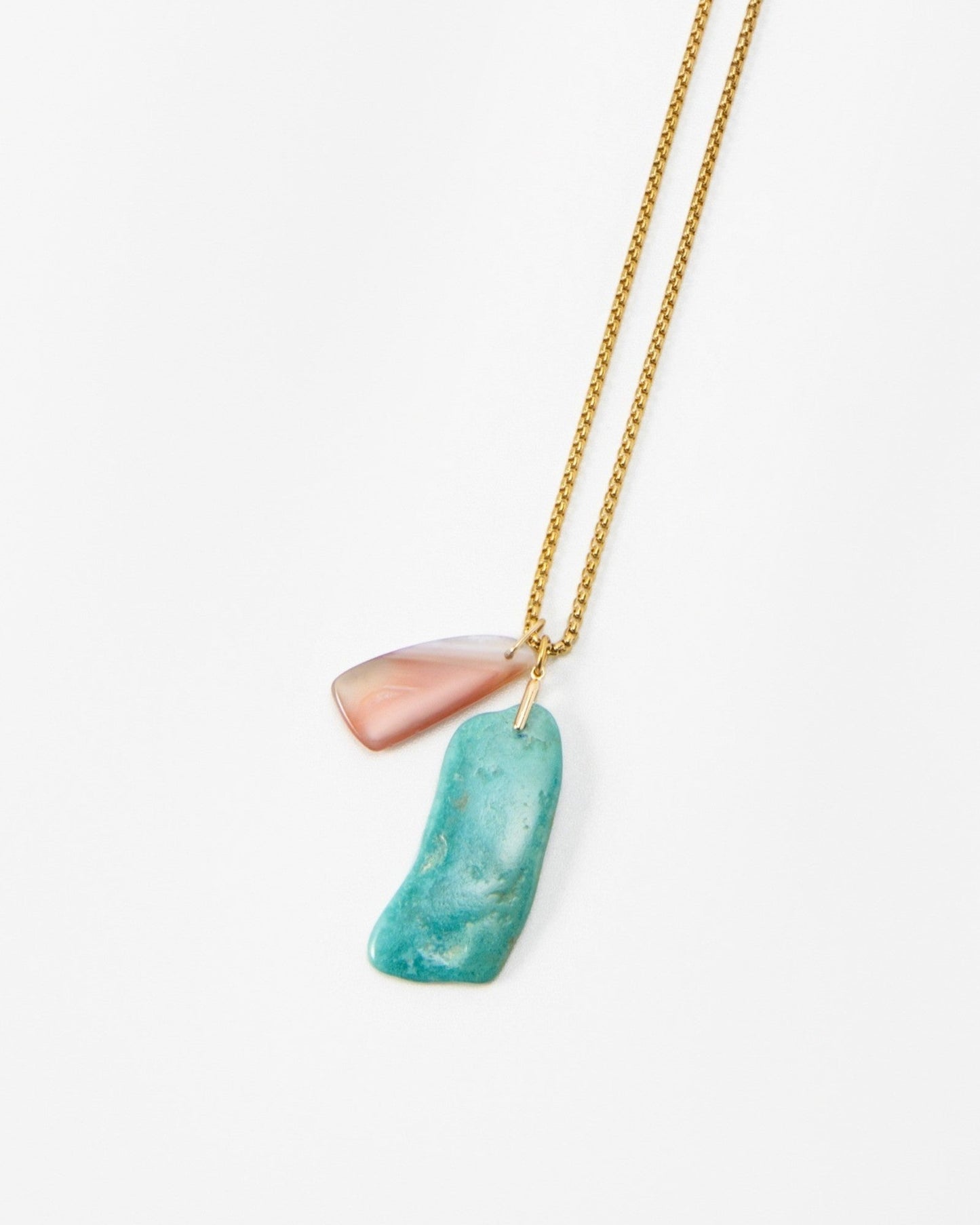 Elsita Jewelry Rusty I necklace featuring a delicate gold chain with a pink and turquoise stone pendant