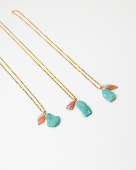 Elsita Jewelry Rusty II gold chain necklaces featuring raw turquoise and orange stone pendants