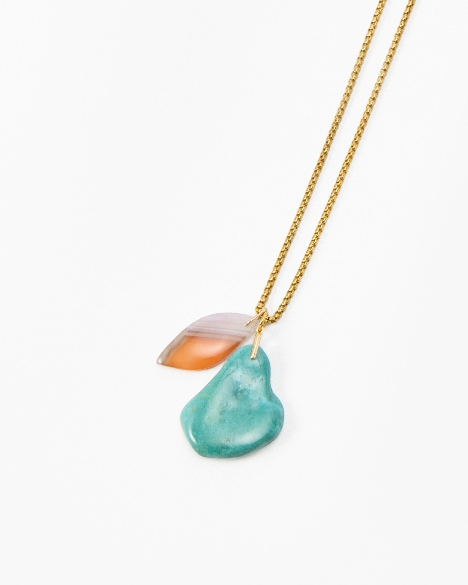 Elsita Jewelry Rusty III necklace featuring a long gold chain with a layered turquoise and orange stone pendant