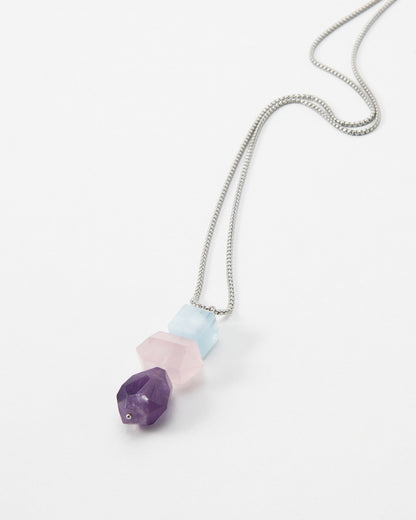Elsita Jewelry Shape necklace featuring three faceted geometric gemstone beads in purple, pink, and light blue.