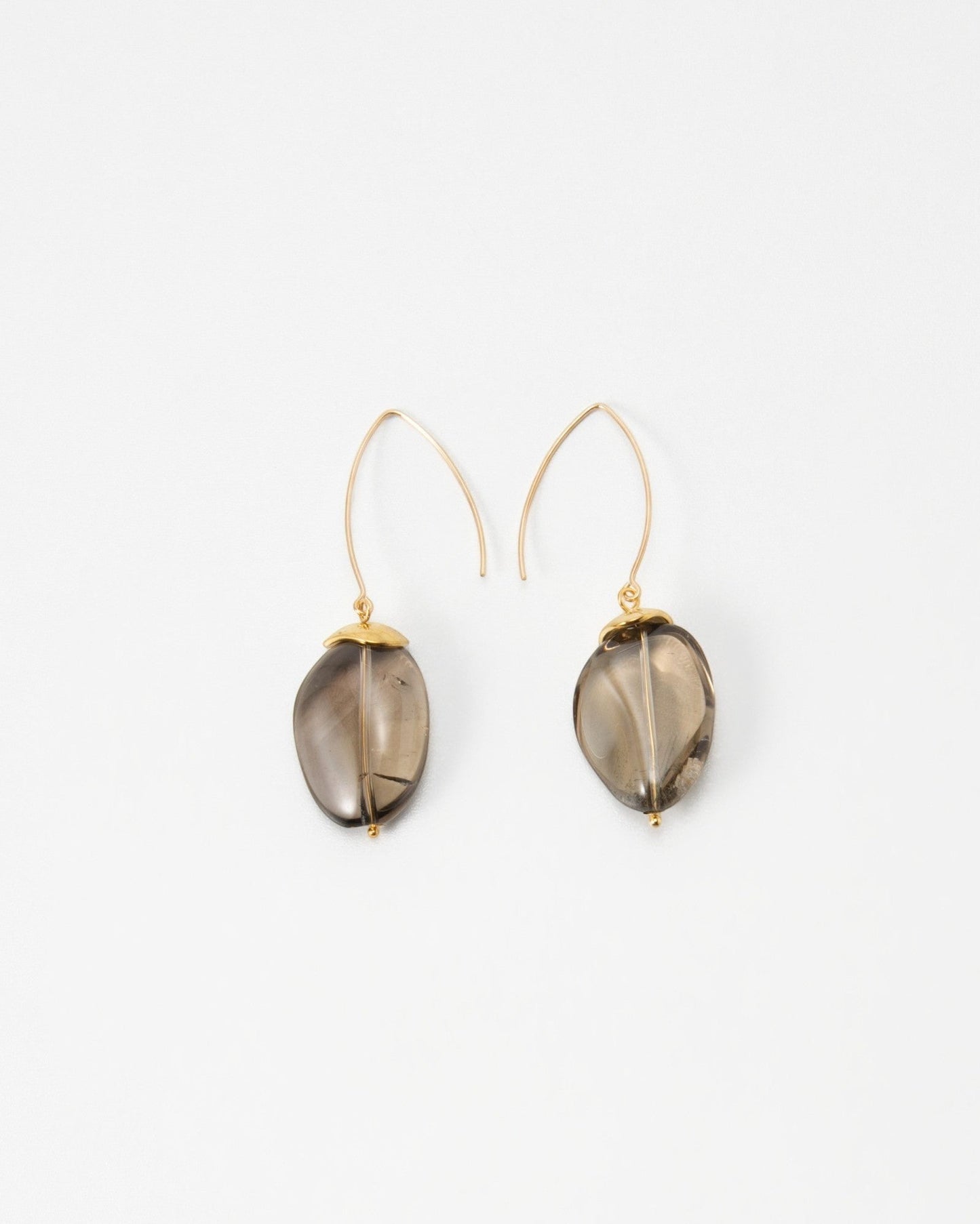 Elsita Jewelry Smoke earrings featuring translucent grey teardrop-shaped stones on delicate gold wire hooks.