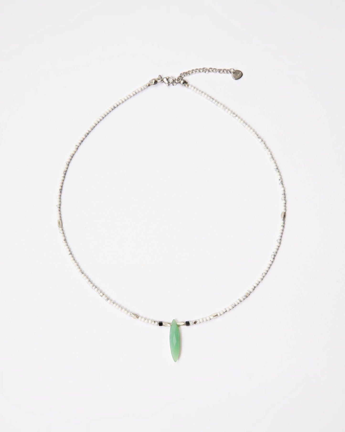 Elsita Jewelry Snowline Green necklace featuring white howlite beads, a green chrysoprase pendant, and silver accents.